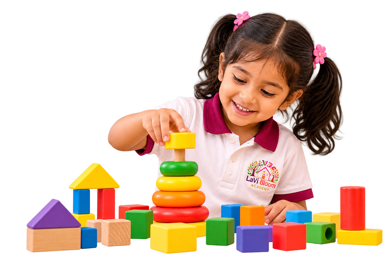 A smiling girl in a LaVi Bloom Academy polo shirt stacking colourful toy rings and blocks